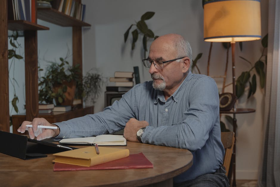 Older adult comfortably following an online lesson at home
